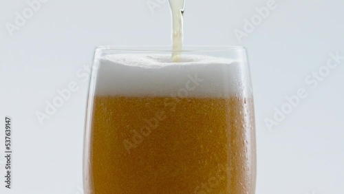 Wallpaper Mural Cold craft beer pouring to glass in super slow motion close up. Drink foaming. Torontodigital.ca