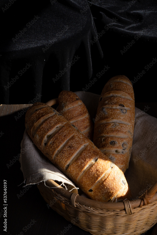 Homemade fresh bread on a dark background