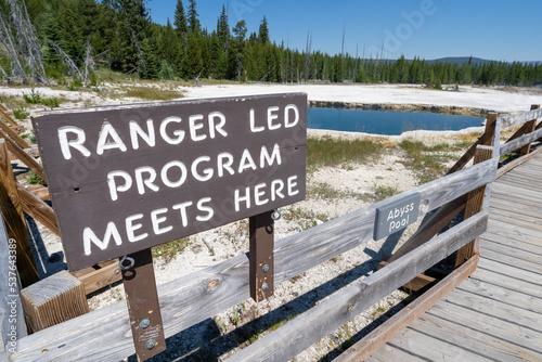 Sign - Ranger-led program meets here, in front of Abyss Pool, for tours and guides of West Thumb Geyser Basin in Yellowstone National Park photo