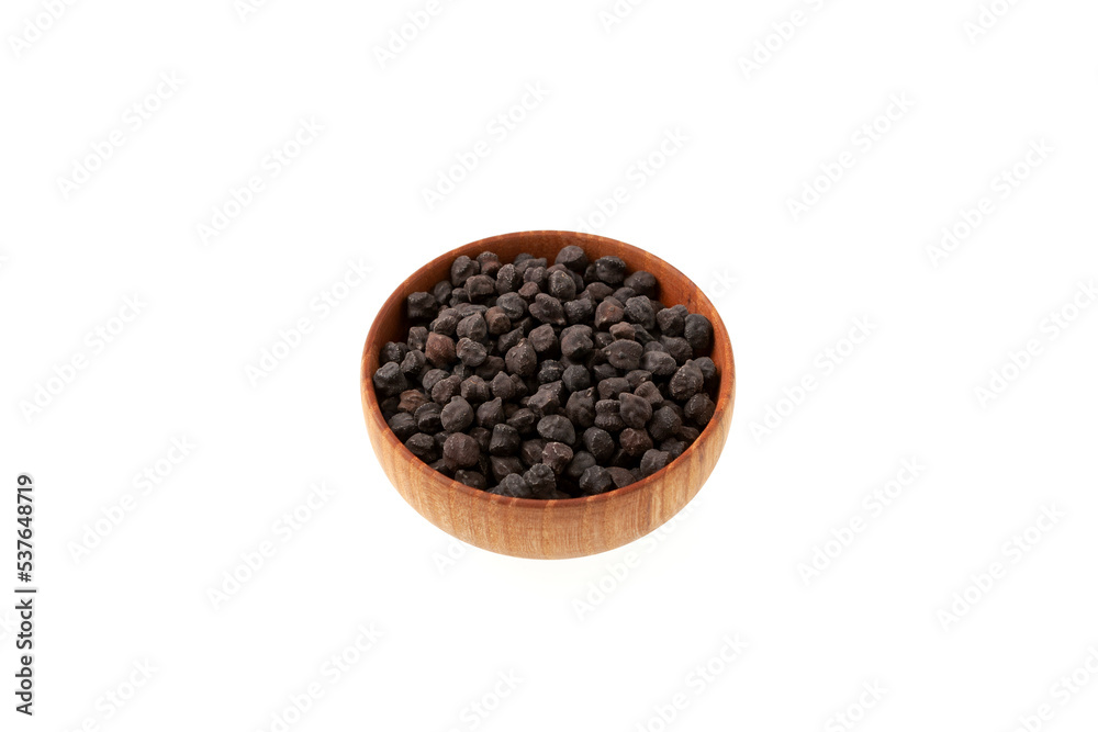 Dried Black chickpeas in wooden bowl isolated on white background, side view. Black chickpeas, with their high fiber content, are very healthy to consume Dried Black chickpeas in wooden bowl isolated on white background, side view. Black chickpeas, with their high fiber content, are very healthy to consume