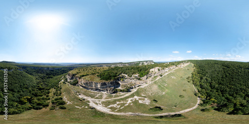 Panoramic aerial view over the Chufut-Kale gorge, where the Silk Road passed, Bakhchisarai, Crimea. HDRI 360 degree seamless spherical  panorama. Stone city of the Crimean Karaites. VR content photo