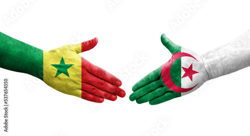 Photography Handshake between Algeria and Senegal flags painted on hands, isolated transparent image