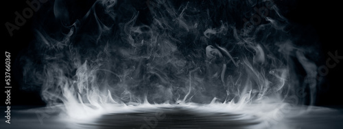Real smoke exploding outwards with empty center. Dramatic smoke or fog effect for spooky Halloween background. © Leigh Prather