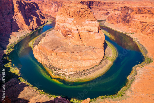 Horseshoe Bend above emerald Colorado River at sunset, Page, Arizona, USA