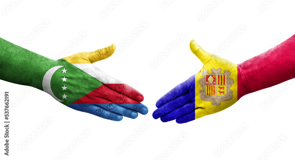 Handshake between Andorra and Comoros flags painted on hands, isolated transparent image. Handshake between Andorra and Comoros flags painted on hands, isolated transparent image.