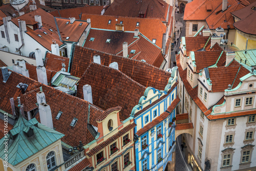 Above medieval Prague old town roofs and attics at evening, Czech