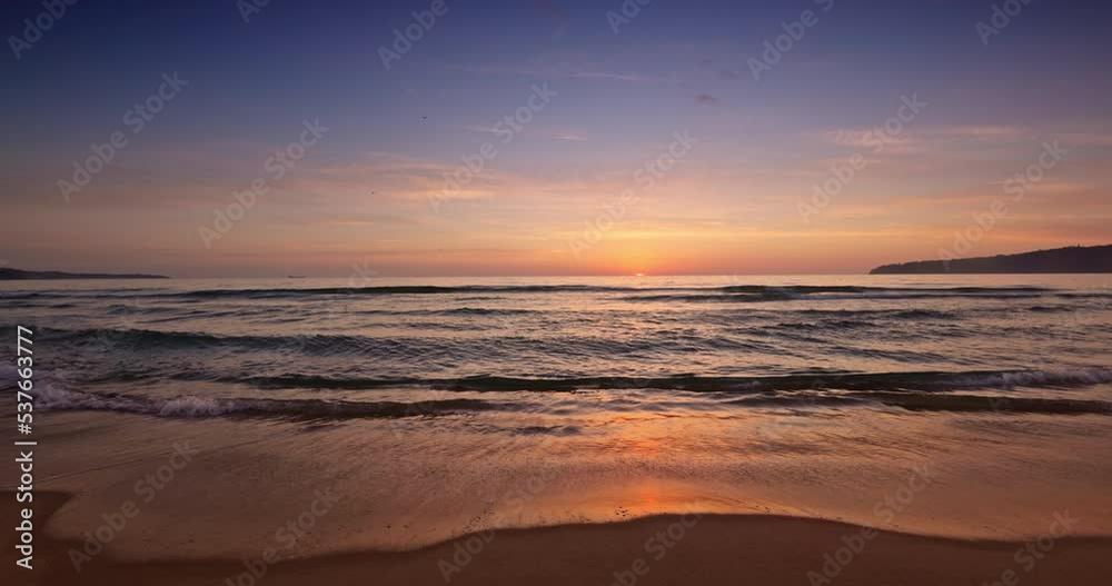 Tropical island and color ocean beach sunrise in 4k video, seascape view Tropical island and color ocean beach sunrise in 4k video, seascape view