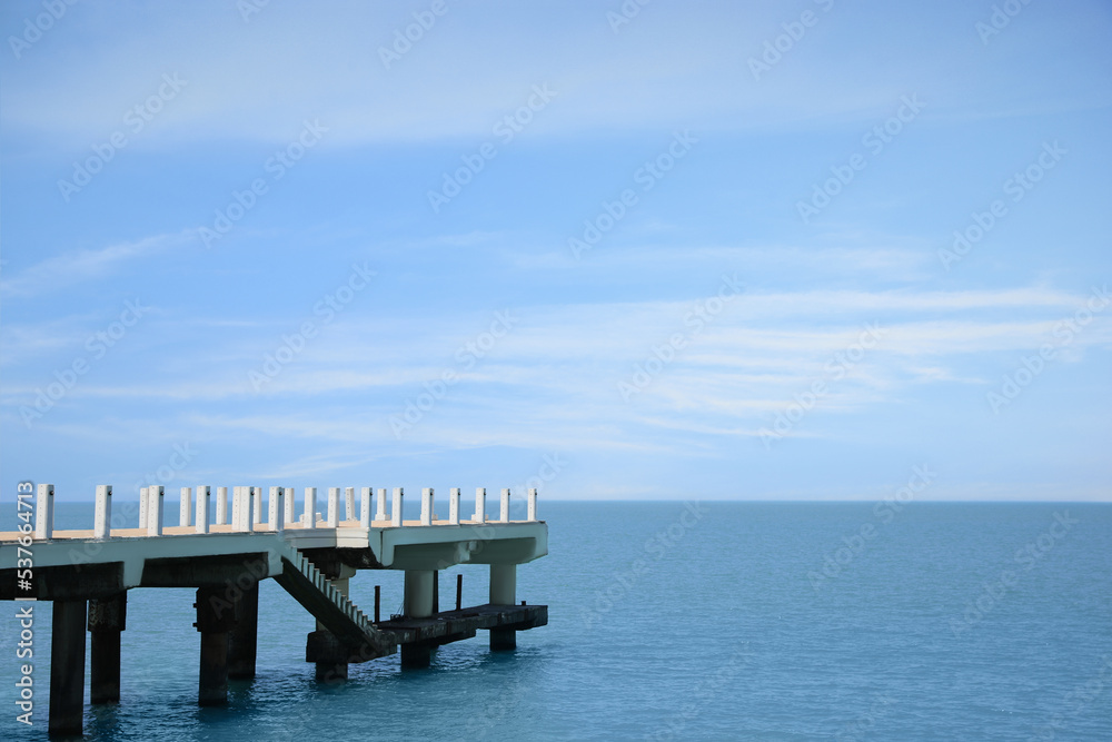 Beautiful white pier in sea on sunny day, space for text