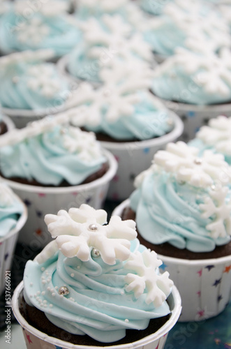 cupcake with icing and sprinkles in light blue color