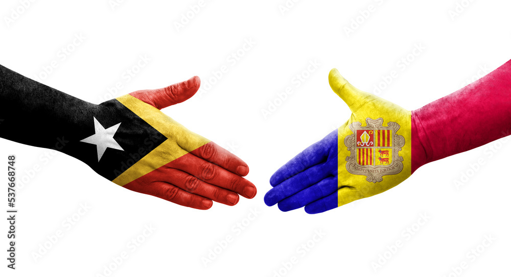 Handshake between Andorra and Timor Leste flags painted on hands, isolated transparent image. Handshake between Andorra and Timor Leste flags painted on hands, isolated transparent image.