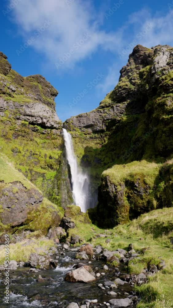 Irafoss Waterfall in Iceland with Blue Sky Vertical Video Irafoss Waterfall in Iceland with Blue Sky Vertical Video