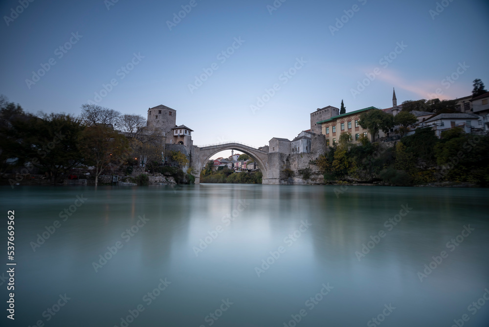 Mostar bridge touristical destination unesco worid heritage with blue sky and lights