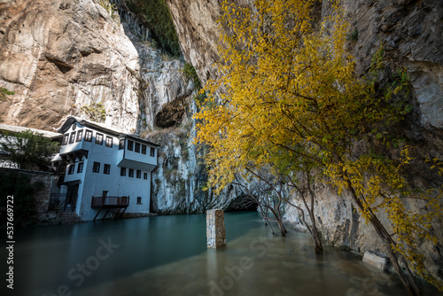 Touristic destination, blagaj tekija with beautiful scenery view and waterfall and water comes from mountain
