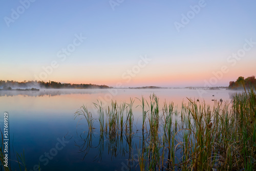 Fototapeta Naklejka Na Ścianę i Meble -  Picturesque Williamstown lake at misty dawn Lakeville New Brunswick Canada