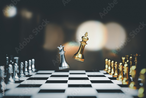 Fotografie The golden and silver kings of chess are the last ones standing on the chess board, the concept of successful business leadership, confrontation and loss