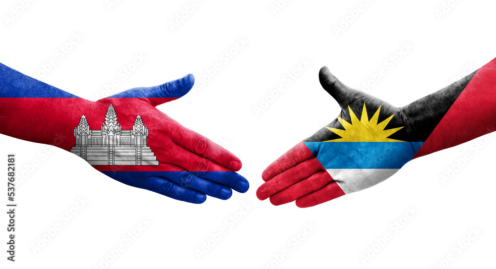 Handshake between Antigua and Barbuda and Cambodia flags painted on hands, isolated transparent image. Handshake between Antigua and Barbuda and Cambodia flags painted on hands, isolated transparent image.