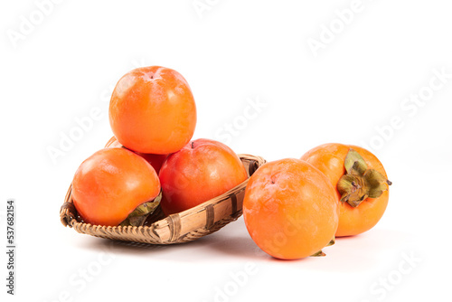 Ripe persimmon fruit isolated on white background..Close up of fresh kaki photo