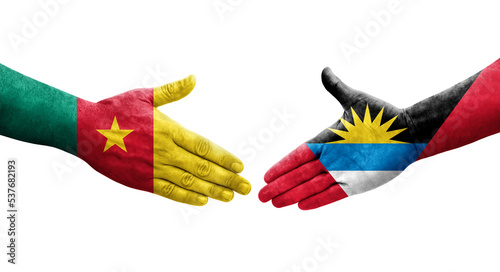 Handshake between Antigua and Barbuda and Cameroon flags painted on hands, isolated transparent image.