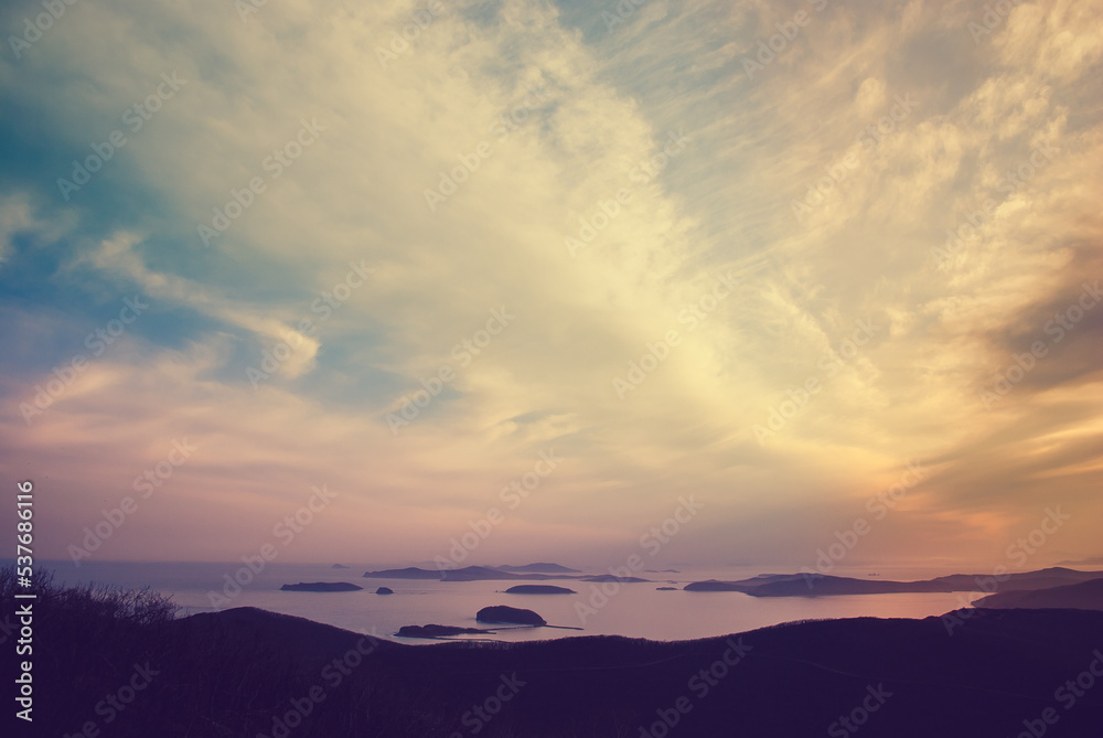 Blurred background. Beautiful sunset in the mountains. Pink sunset over the sea. Blurred background. Beautiful sunset in the mountains. Pink sunset over the sea.