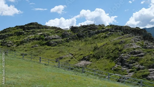 Video of Kalbak-Tash open-air museum. Altai Petroglyphic Complex. photo