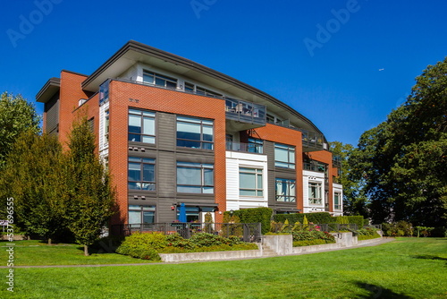 Fotografi Fragment of  Apartment Building with sundecks and front yard in new residential
