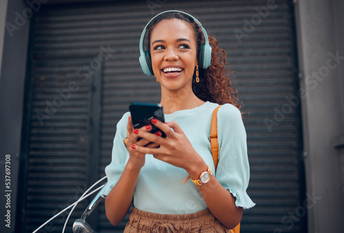 Schilderij op canvas Black woman, smile and phone for social media in the city with headphones in joy for 5G connection in the outdoors