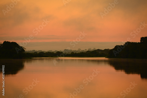 Dawn on a misty Guaporé - Itenez river, near the remote village of Cafetal, Beni Department, Bolivia, on the border with Rondonia state, Brazil