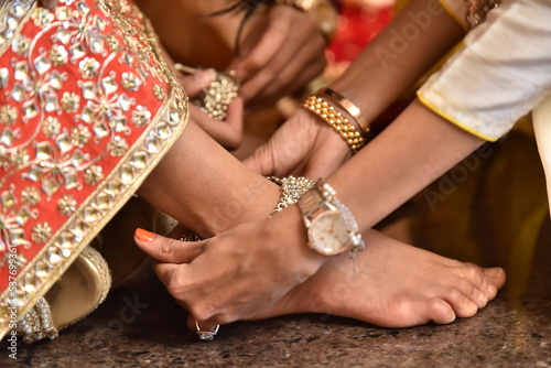 Mumbai, India 14th September 2022: Indian Wedding rituals, Customs and Traditions for bride or Dulhan. Pandit performing holy pooja. Shagun, Mehendi, and old customs. Poojan vidhi and samagri. photo