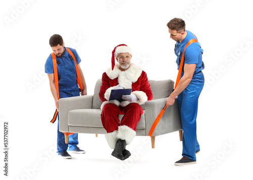 Male loaders carrying sofa ...