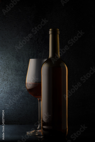 red wine glasses and bottle on stone background