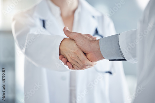 Handshake, medical and doctors have agreement on patient health, illness treatment plan or diagnosis in clinic. Professional nurse, promotion or solution for virus, medicine or healthcare in hospital