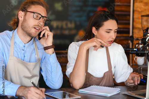 Business owners working at ...