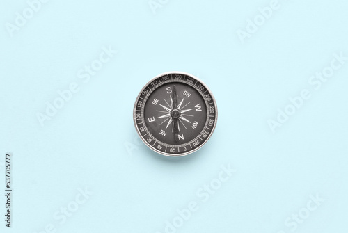 Vintage compass on blue background