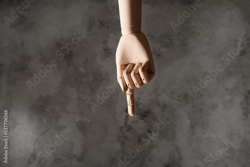 Wooden hand with raised ind...