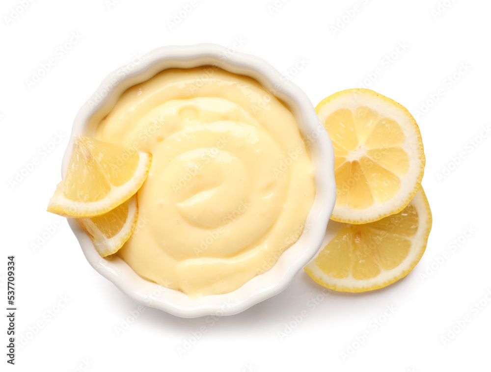 Ramekin of delicious vanilla pudding and lemon on white background Ramekin of delicious vanilla pudding and lemon on white background