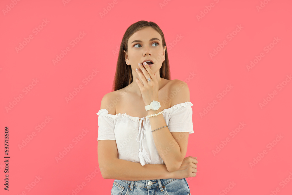 Concept of people, young woman on pink background Concept of people, young woman on pink background