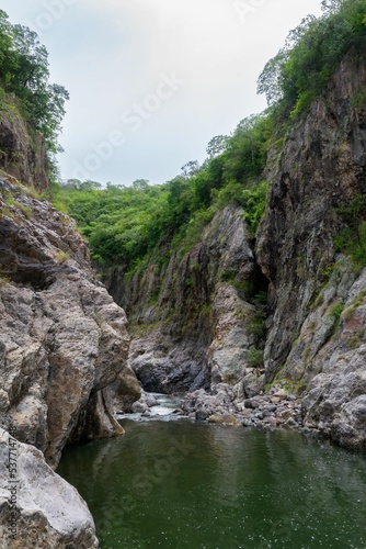 Vertical shot of a rocky river in the Somoto canyon photo
