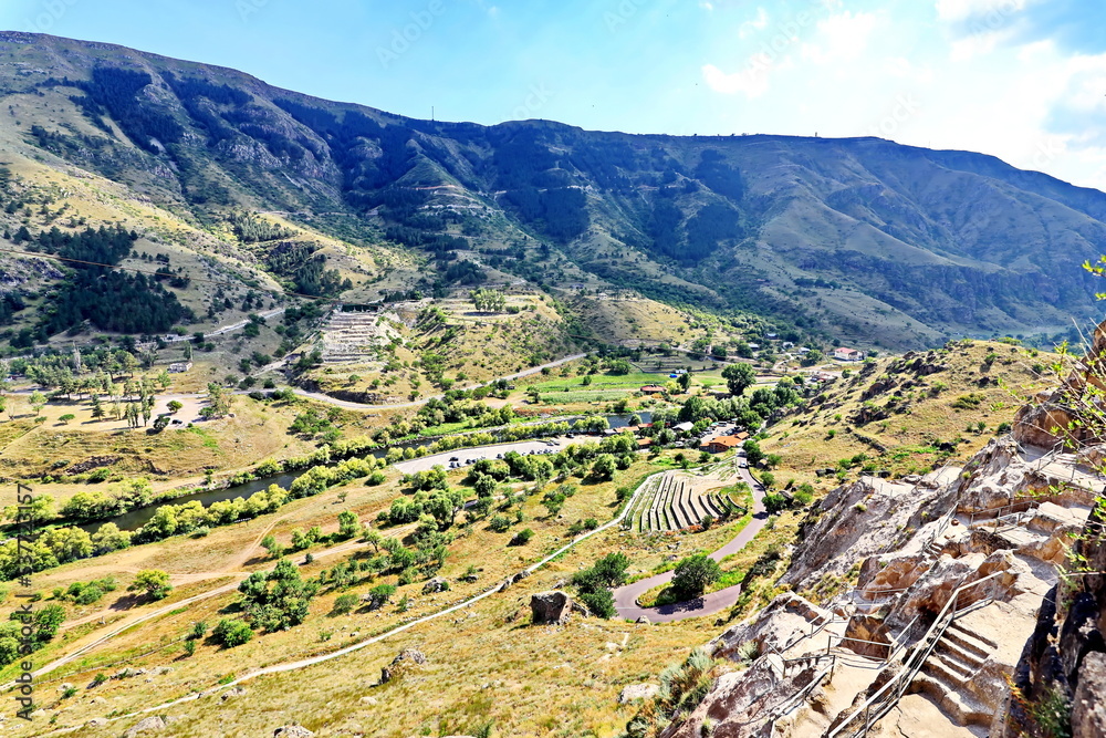 Panoramic view of the nature of Georgia.                                                                                          The ancient cave city of Vardzia in the Caucasus mountains. Summer 201