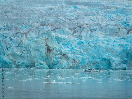 Panorama view of the 14th of July Glacier or the Fjortende Julibreen. Is a beautiful glacier found in northwestern Spitsbergen. Floating Pack Ice in the arctic ocean.  photo