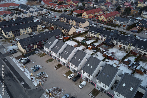 Winter season in Europe town, aerial view. Residential neighborhood quarters with town houses in european suburban area