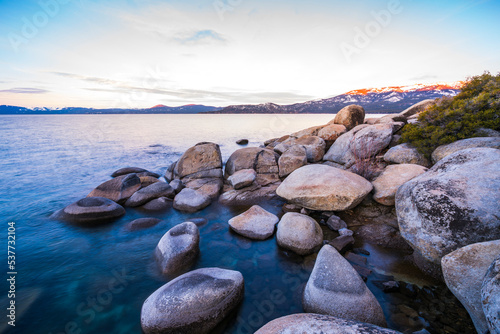 beautiful Lake tahoe at sunset with reflection in water.