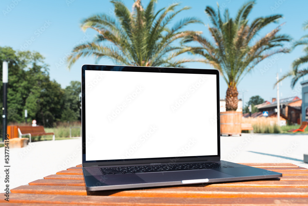 custom made wallpaper toronto digitallaptop mockup. Notebook with white screen with palm tree leafs on background. Vacation, traveling and remote work and study concept. Empty copy space, blank screen modern laptop.