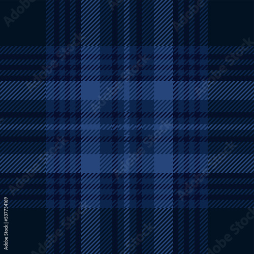 Dark blue tartan plaid. Scottish pattern fabric swatch close-up. 