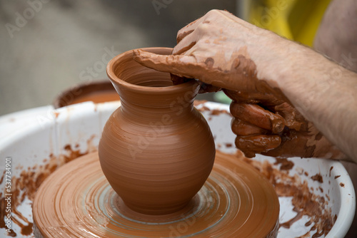 Man making ceramic pot