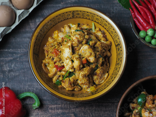 A full set of Thai food on a wood table