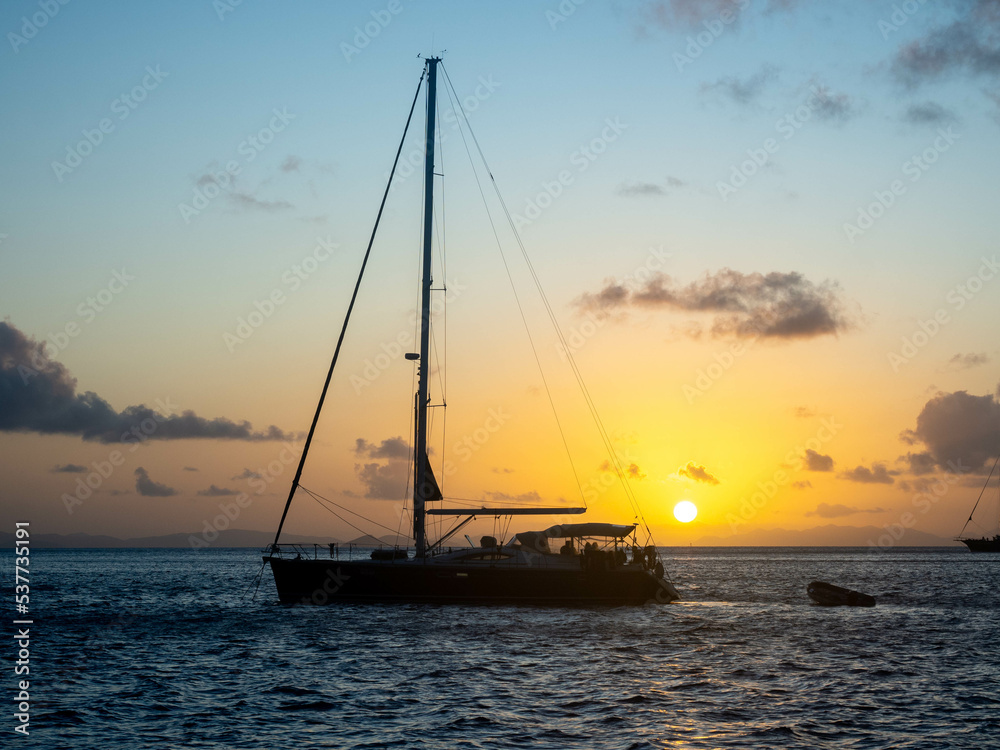 Still sailboat at sunset