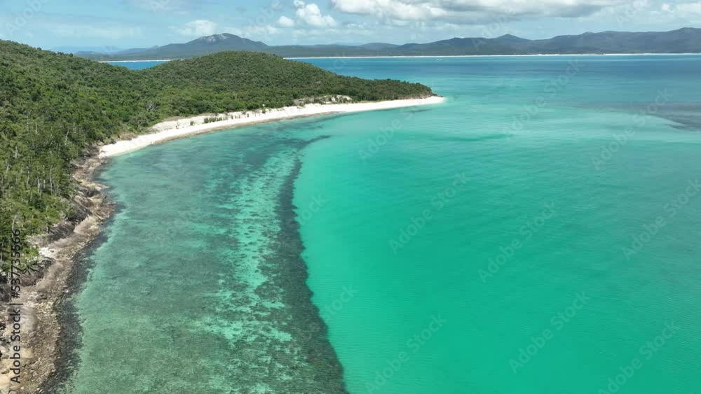 flying over the great barrier reef in the whitsundays, over a yacht, in queensland, Australia flying over the great barrier reef in the whitsundays, over a yacht, in queensland, Australia