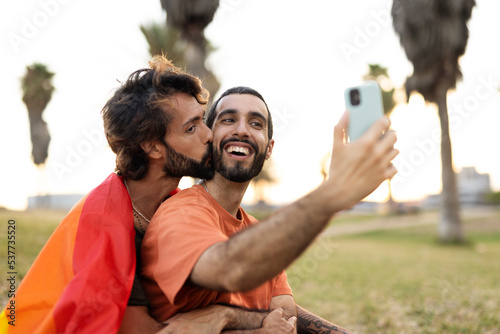 Happy couple taking selfie photo. LGBT community © JustLife