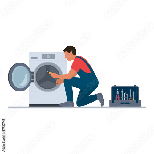 Professional repairman fixing a washer