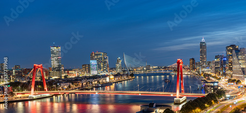 Sky line of Rotterdam at night over the river Maas
